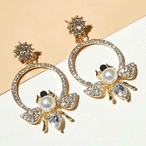 All gold diamond bee earrings